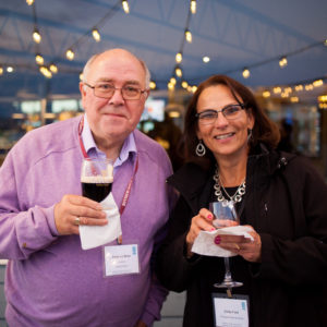 A man and woman posing for a photo at FINEOS Global Summit in 2017