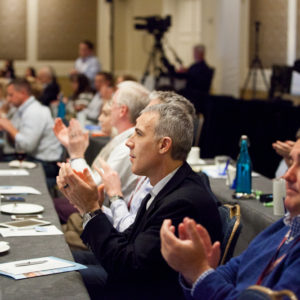 Audience clapping at the FINEOS Global Summit in 2017