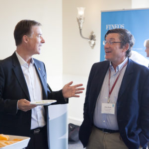 Two men talking to each other during breaktime at FINEOS Global Summit in 2017